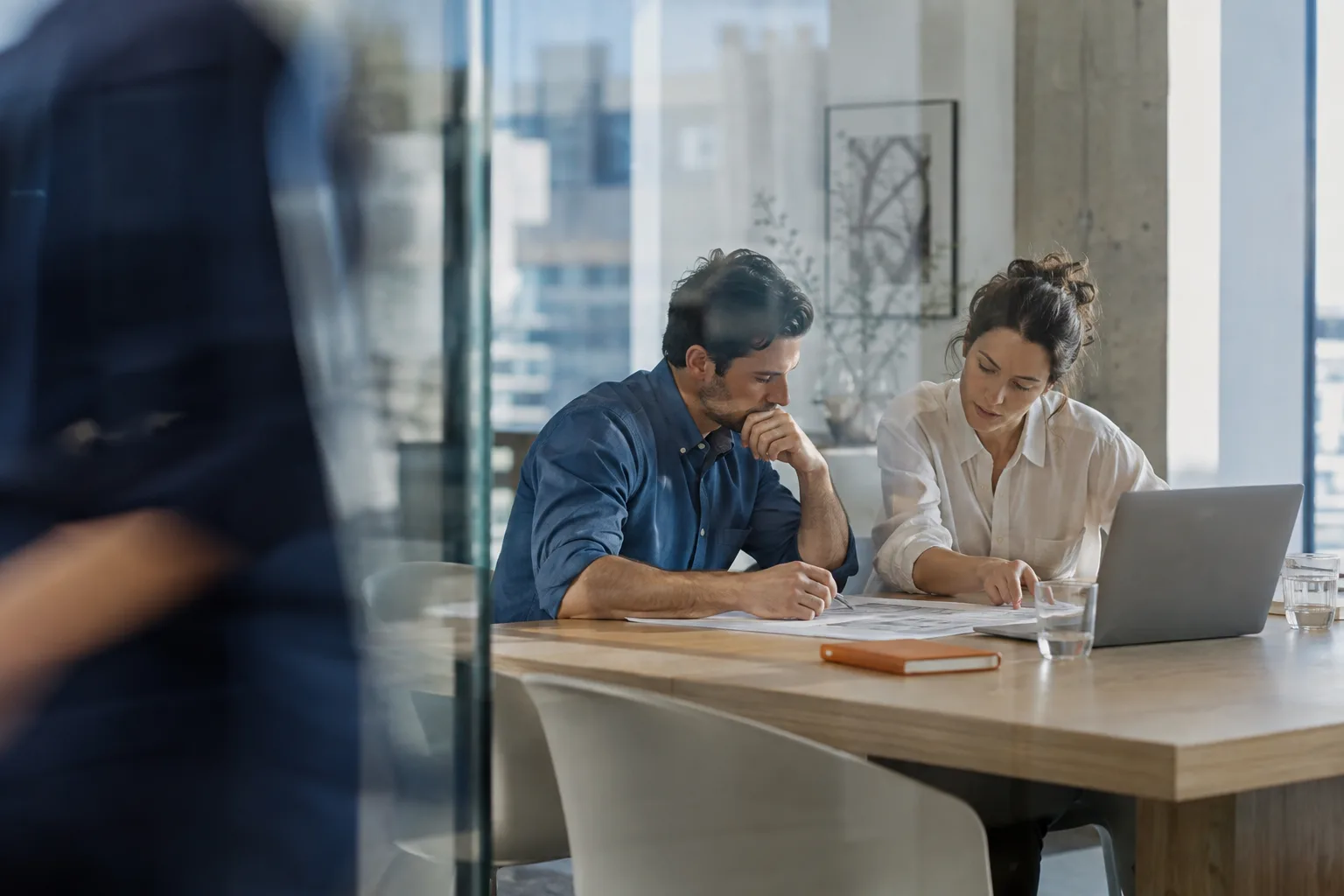 Colleagues working together around a table